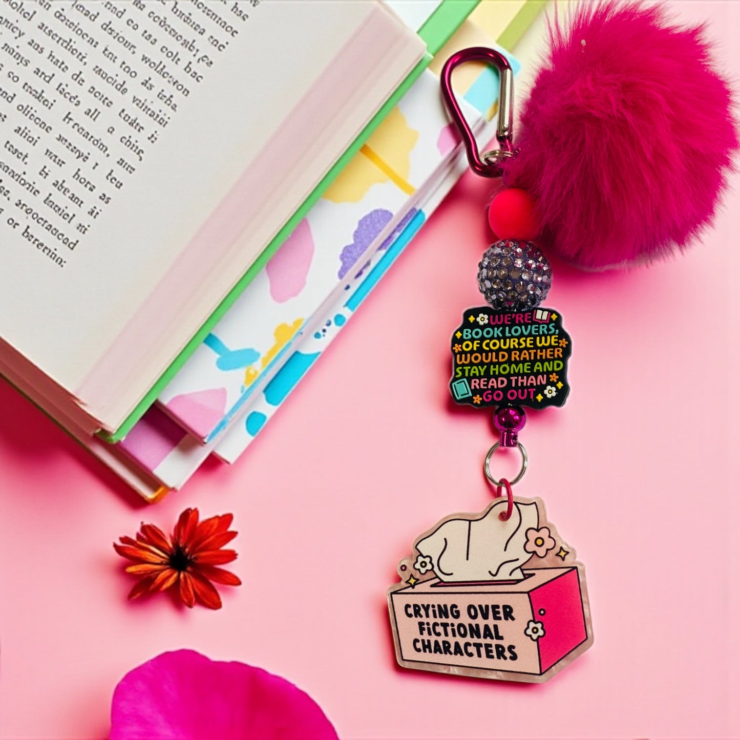 “We are book lovers of course we would rather stay home and read, then go out “.￼Bookish key chain charm, bag charm, Book shelf, Books, Book Lovers, Beaded keychain, Pom Pom keychain, Pink, Rainbow